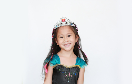 Portrait of happy little Asian girl dressed with a fantasy outfit on white background.の写真素材
