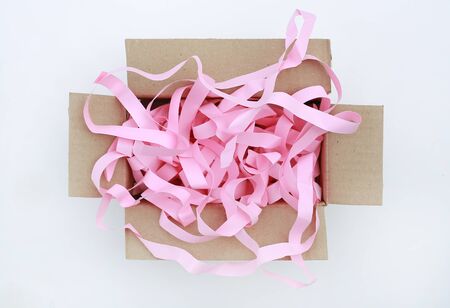Open carton corrugated cardboard box with prevent bumping paper isolated on white background. Top view.の写真素材