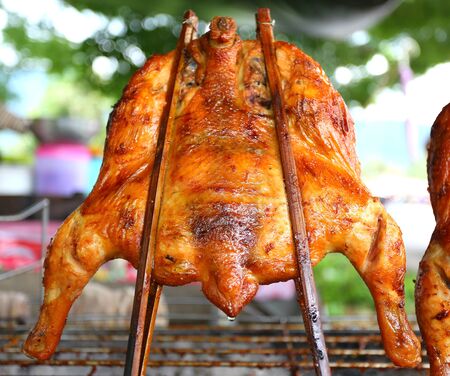 Grilled chicken on a grillの写真素材