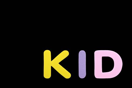 Alphabet sponge rubber of text "KID" isolated over black background with copy spaceの写真素材