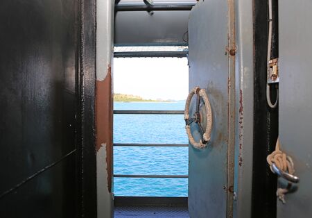 Opened door in the ship. View from inside.の写真素材