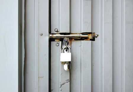 Metal door with key locked.の写真素材