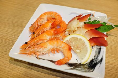 Shrimp baked on white plateの写真素材