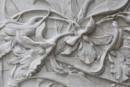 The Sculpture of flower decorative on the wallの写真素材