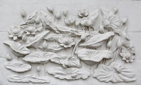 The Sculpture lotus of native thai style decorative on the wallの写真素材