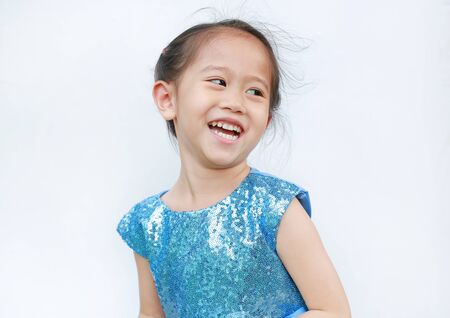 Portrait of happy child girl in shine blue dress on white background.