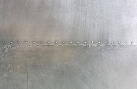 Stainless wall with nut background.