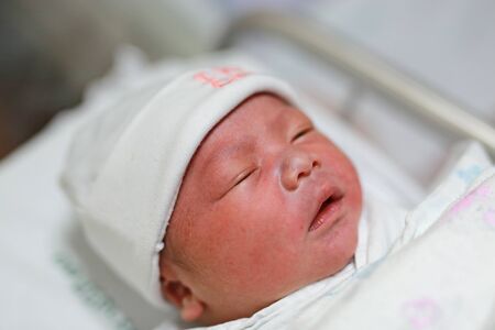 Face of baby infant sleep in the blanketの写真素材