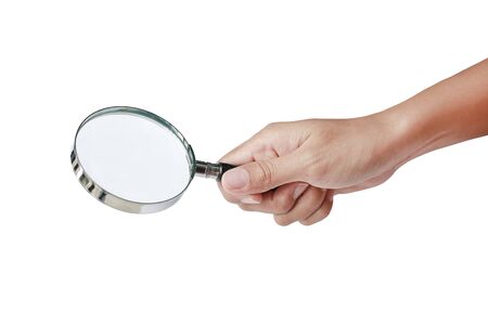 Hand holding Magnifying glass isolated on whiteの写真素材