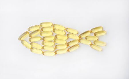 Fish oil capsules on a white backgroundの写真素材