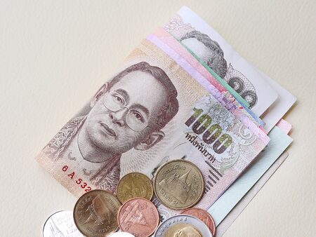 Close up of Thai money banknotes and coins for background.の写真素材
