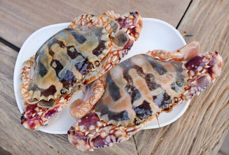 Fresh red horse crab on white plate