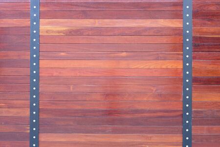 natural wooden fence texture with nuts