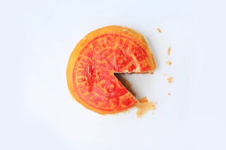 Traditional Chinese pastry or moon cake with lucky word printed on top isolated on white background.
