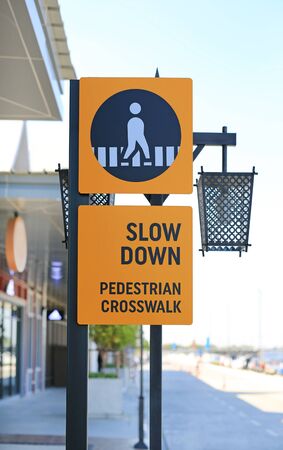 Slow down pedestrian crossing road label Sign.の写真素材