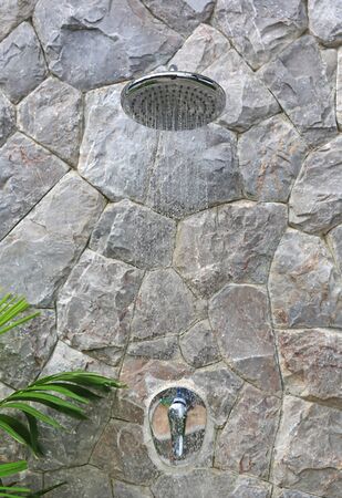 Outdoors shower behide Swimming poolの写真素材