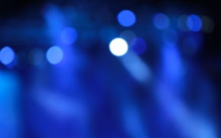 Blurred Concert light with colored spotlights and smoke.の写真素材