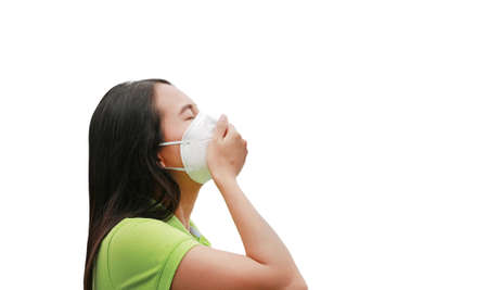 Portrait asian woman wearing protection mask to protect virus covid-19 and air pollution by hand...
