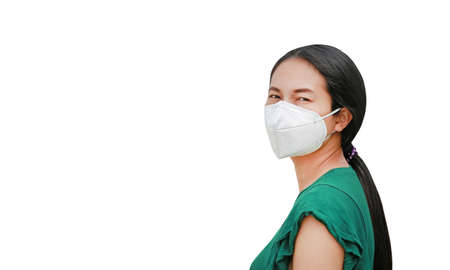 Asian woman wearing protection mask to against virus covid-19 and air pollution isolated on white backgroundの写真素材