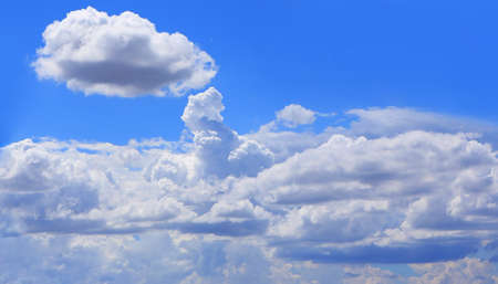 blue sky with white fluffy cloud background