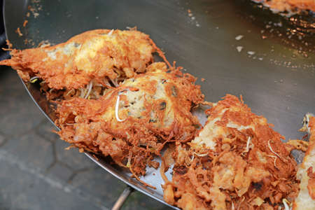 Fried mussel pancakes in hot plate, Thai style.