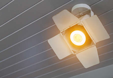Closeup Spotlights switch on hanging from ceiling.