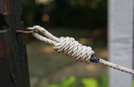 Close up Rope tied up to a knot.