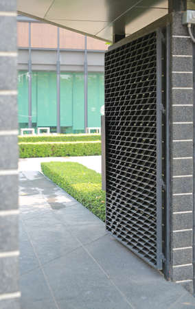 Modern metal door of condominium is opened.