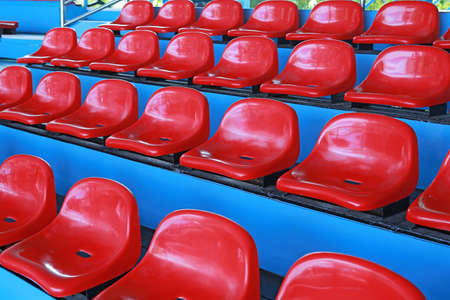 Red seats on the row at the stand.の写真素材