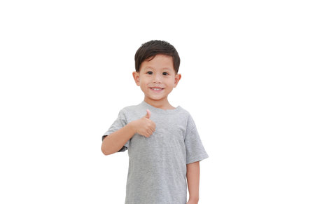 Smiling Asian baby boy age about 3 years old thumb up gesture on white background isolated with clipping path.の写真素材