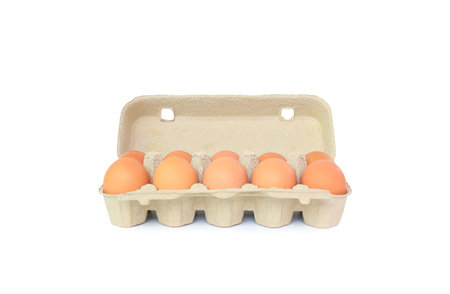 Chicken brown eggs in carton box isolated on white background