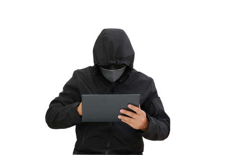 Hacker in hooded using tablet to hacking data isolated over white backgroundの写真素材