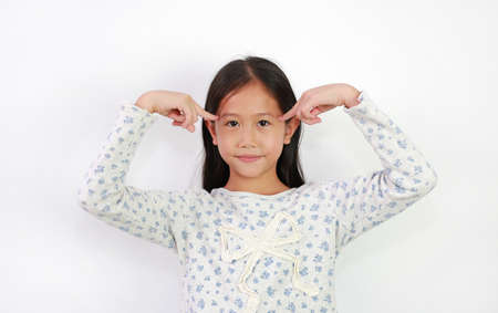 Asian young girl kid think gesture with index finger point brain head for new idea and imagination...