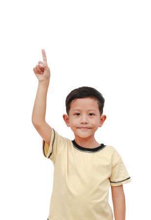 Portrait of Asian little boy kid pointing up isolated on white background.の写真素材