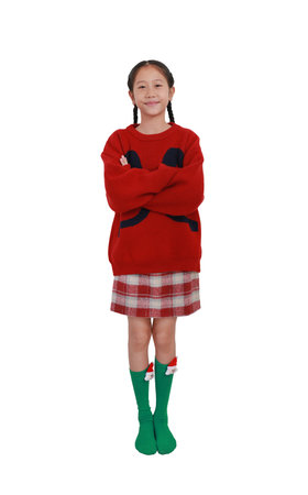 Asian girl child in New Year and Christmas costumes isolated on white background. Kid make cross arms posture while standing, Full body photo.の写真素材