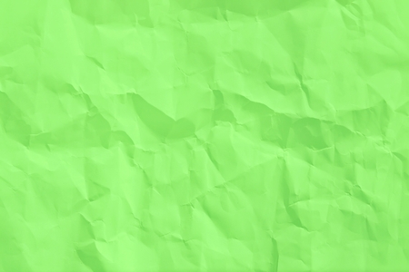 wrinkled sheet of green paperの写真素材