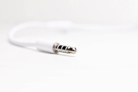 3.5mm white audio jack on white backgroundの写真素材