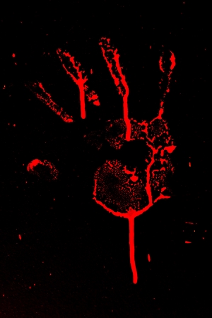 Set of red hand prints on black backgroundの写真素材