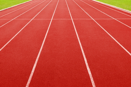 red running track on athletic stadiumの写真素材