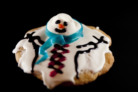 Melted snowman on a black background の写真素材