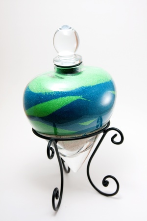 This is a glass heart filled with sand from a couple