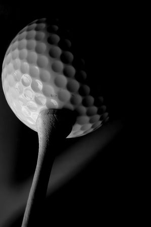 Golf ball and tee  macro in black and whiteの写真素材