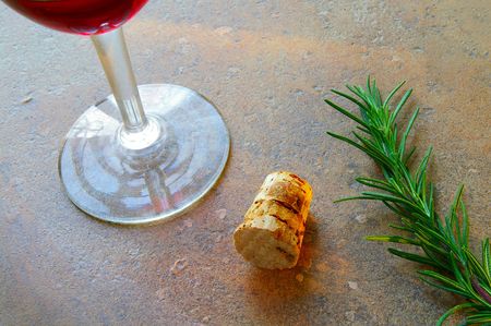 wine glass and cork with rosemaryの写真素材