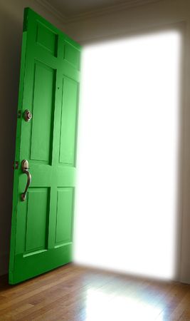 Door opening to bright white spaceの写真素材
