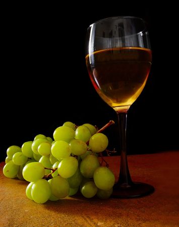 White grapes and glass of wine, on blackの写真素材