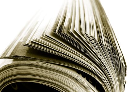 Closeup of a rolled up magazine, on whiteの写真素材