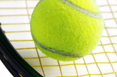 Closeup of a tennis ball and racketの写真素材