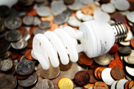 compact fluorescent light bulb on U.S. coinsの写真素材