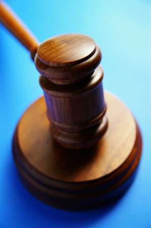 wooden judge's gavel from above, on blueの写真素材