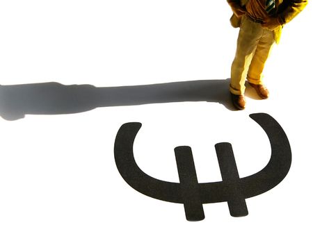 Business man figure standing over a Euro symbolの写真素材